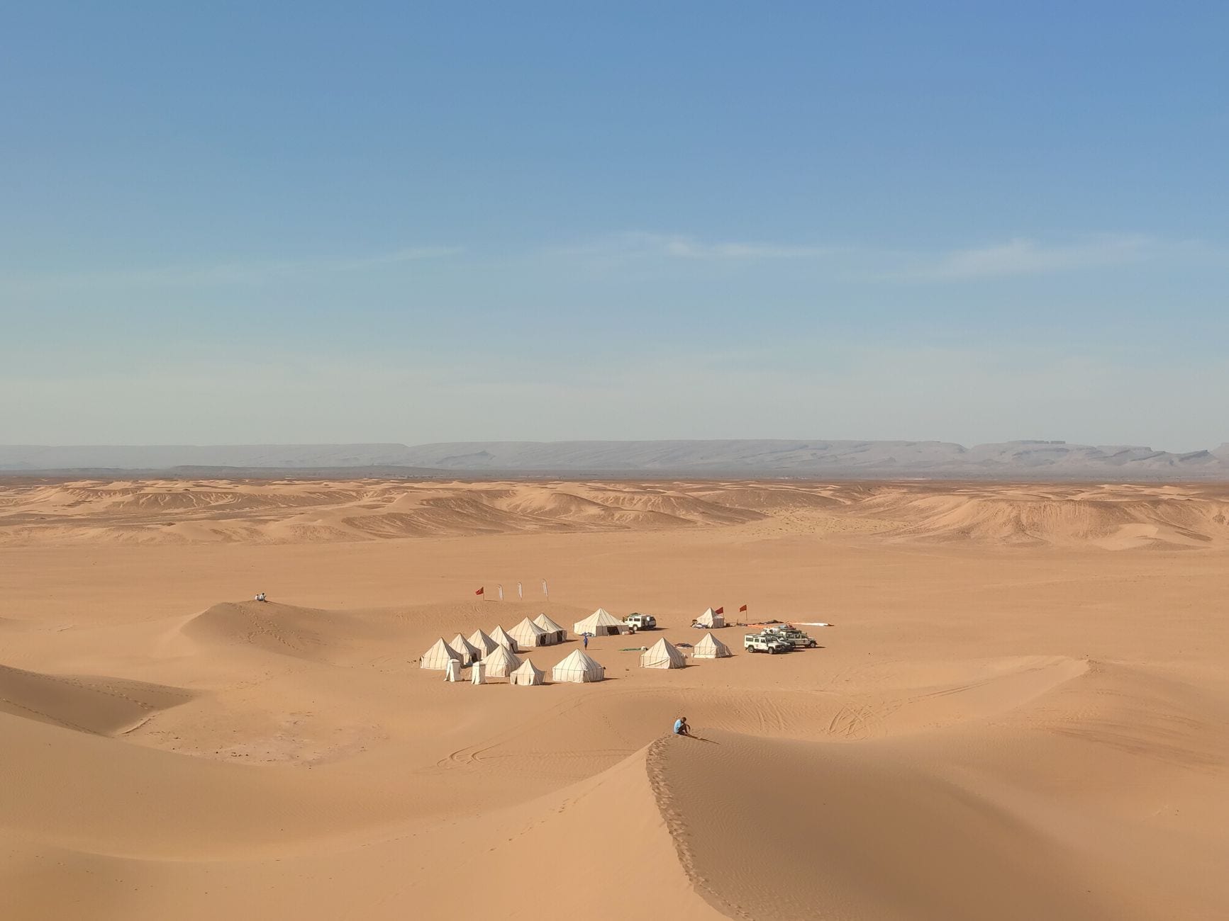 An isolated camp among the Sahara dunes